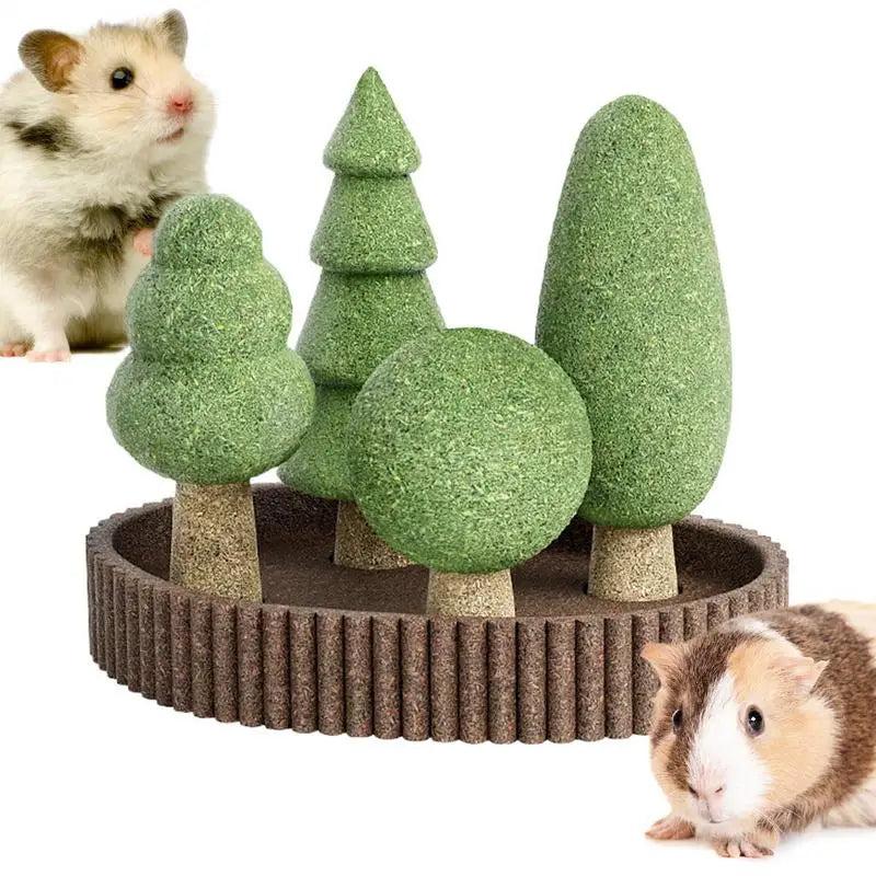 Hamster playing with a green tree-shaped toy on a white background