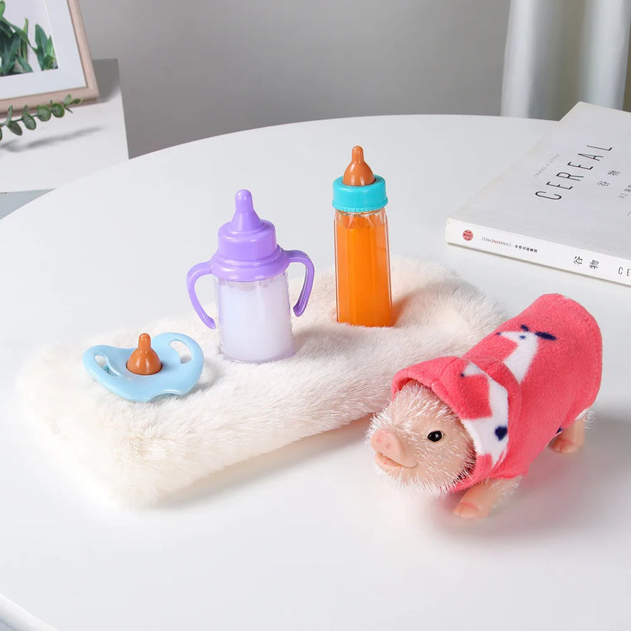 Baby items including a pacifier, sippy cup, and bottles on a white surface with a soft toy in the foreground.