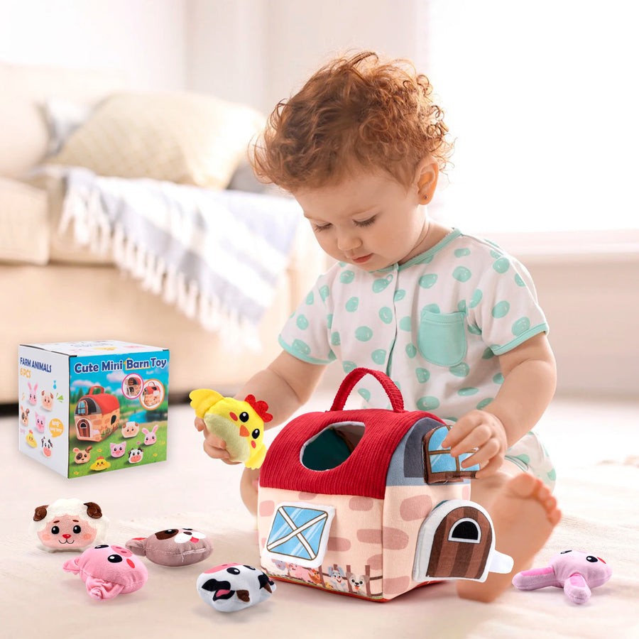 Child playing with a toy barn and farm animals in a living room setting.