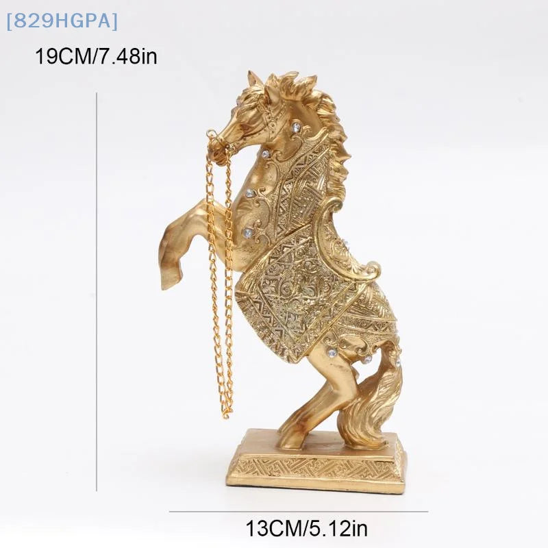 Decorative gold seahorse figurine with intricate details on a white background