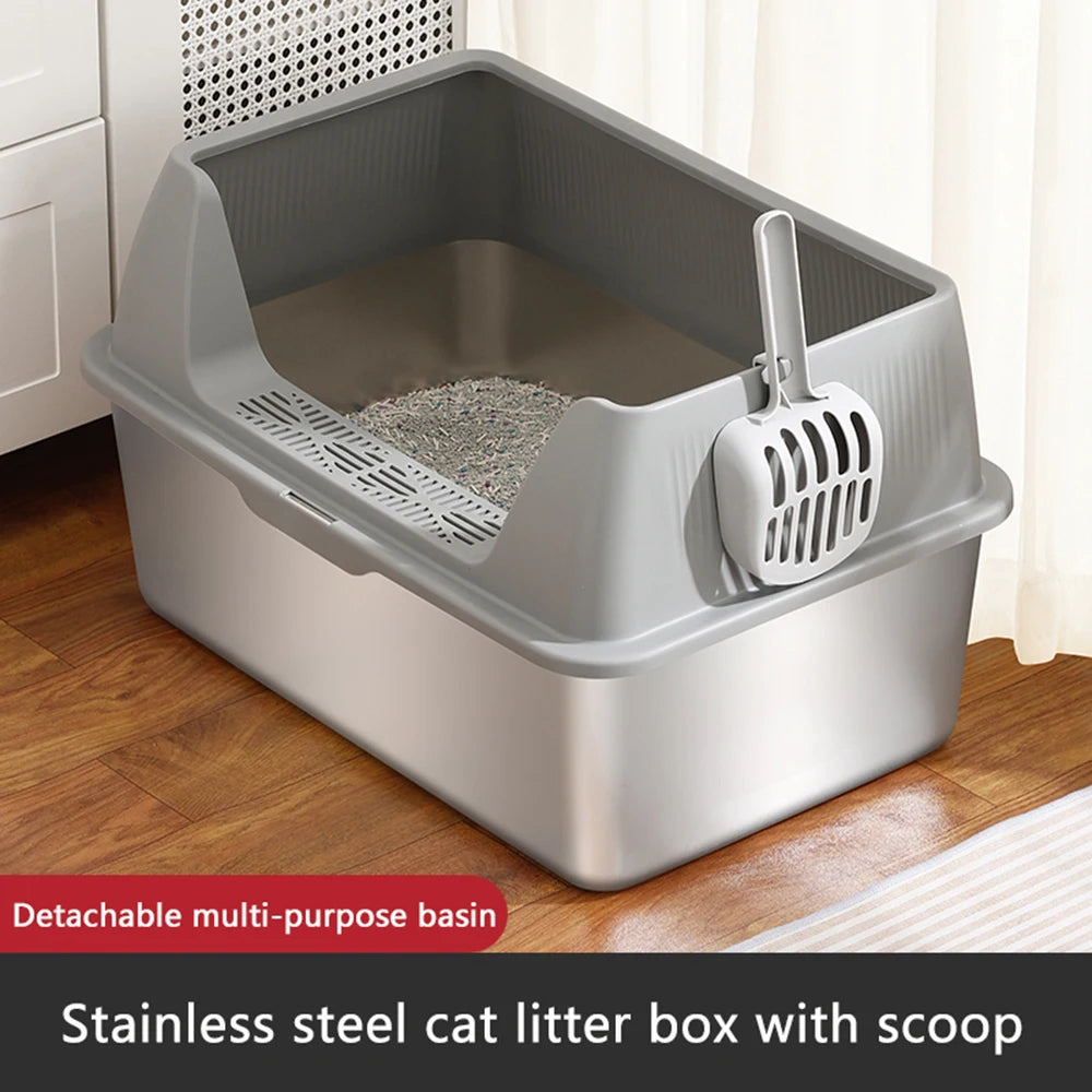 Stainless steel cat litter box with scoop on a wooden floor